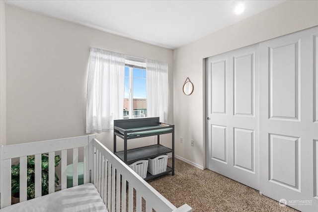 bedroom featuring carpet and a closet