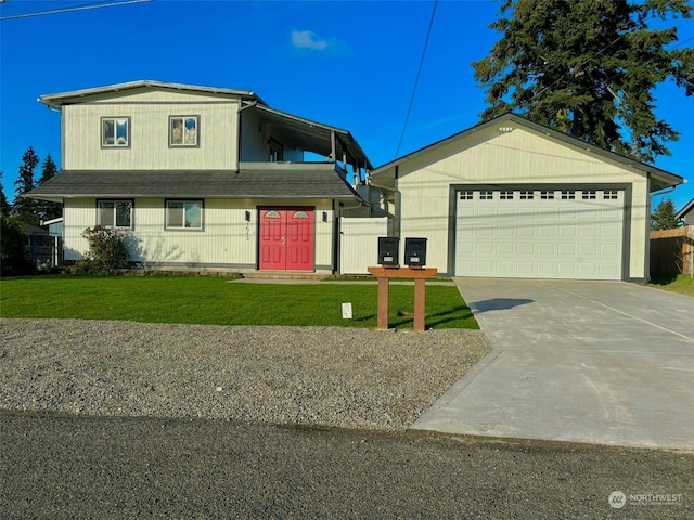 view of front of house with a front yard and a garage