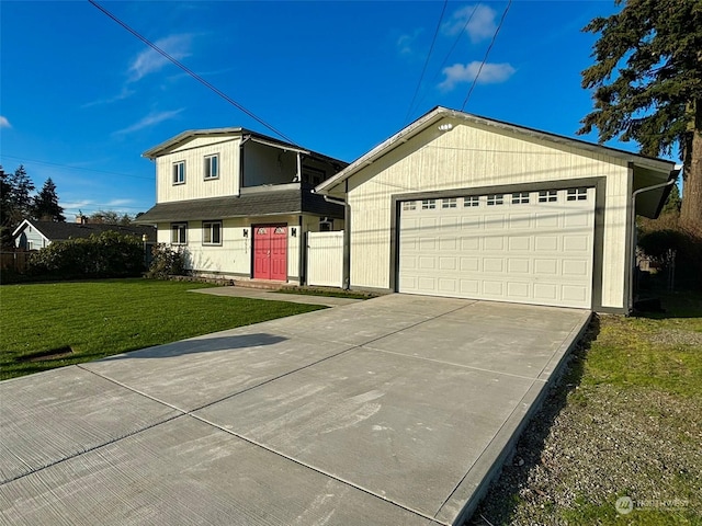 view of front facade with a front lawn and a garage