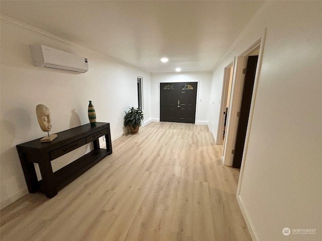 corridor with crown molding, light hardwood / wood-style flooring, and a wall unit AC