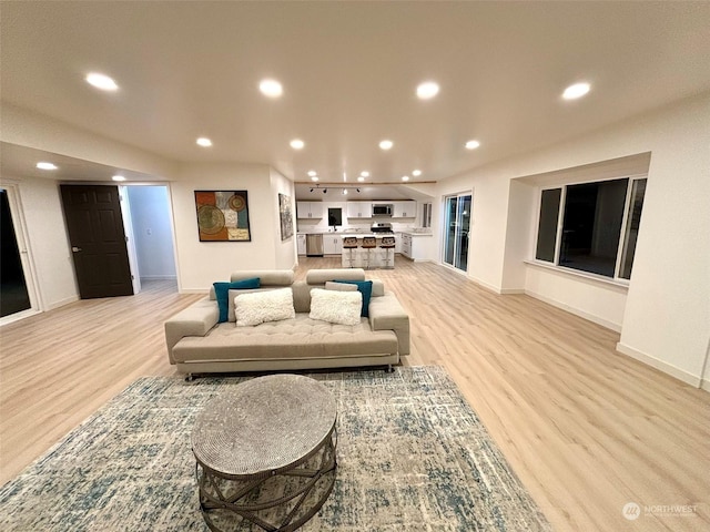 living room with light hardwood / wood-style floors