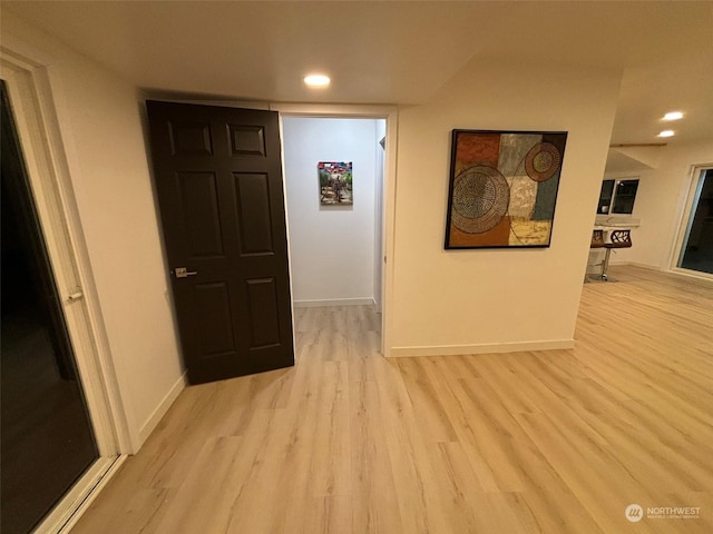 hallway featuring light hardwood / wood-style flooring