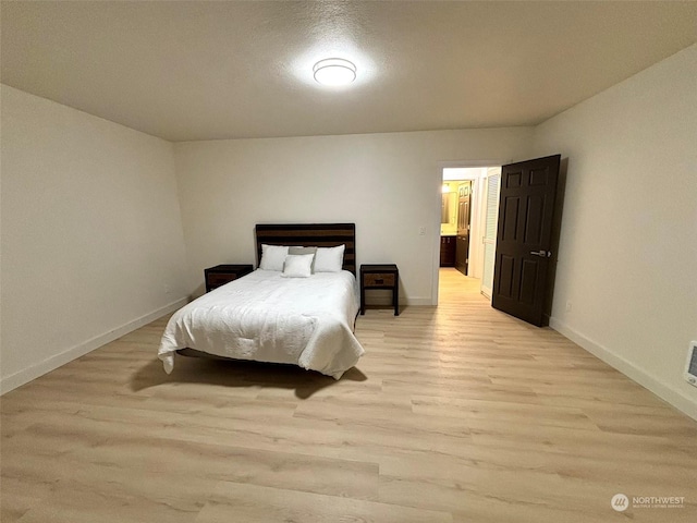 bedroom featuring light hardwood / wood-style flooring