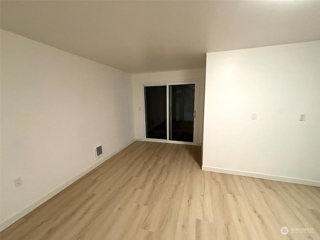 empty room featuring light hardwood / wood-style floors