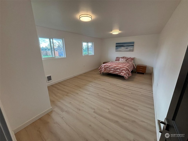 bedroom with light hardwood / wood-style flooring