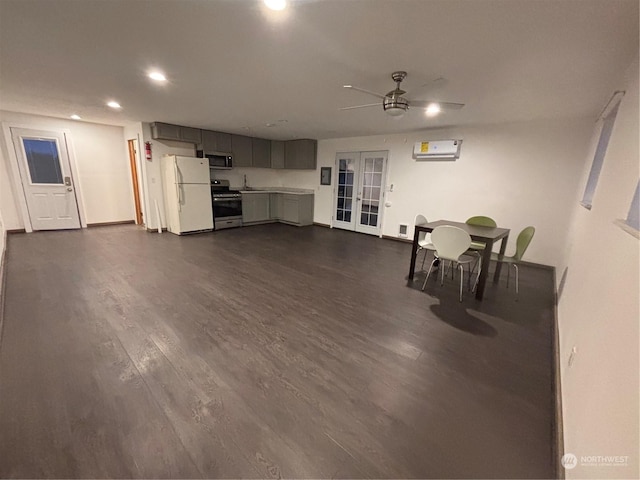 living room with ceiling fan, dark hardwood / wood-style flooring, french doors, and an AC wall unit