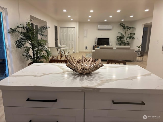 bathroom featuring a wall unit AC