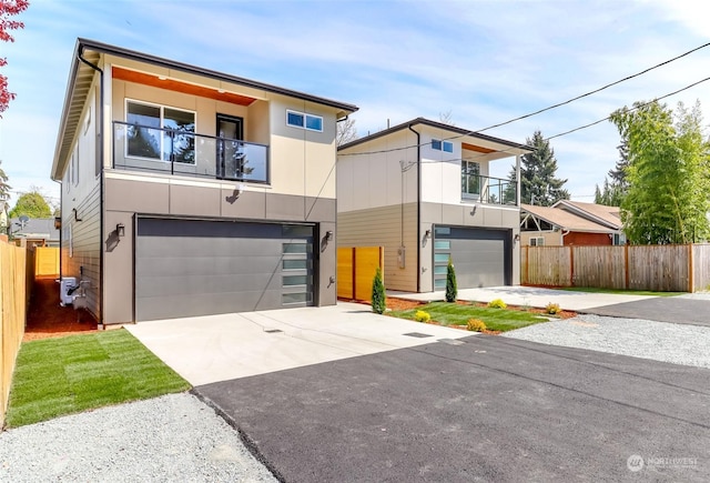 modern home with a balcony and a garage