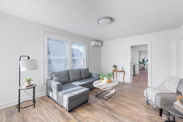 living room featuring hardwood / wood-style floors and a wall mounted air conditioner