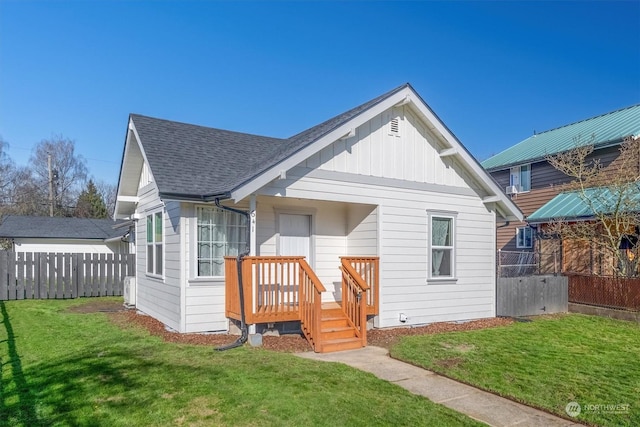 rear view of house with a lawn