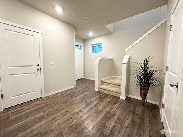 foyer with dark hardwood / wood-style floors