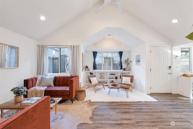 sitting room featuring hardwood / wood-style floors and vaulted ceiling with beams