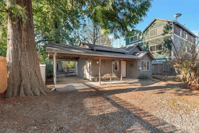 rear view of property featuring a carport