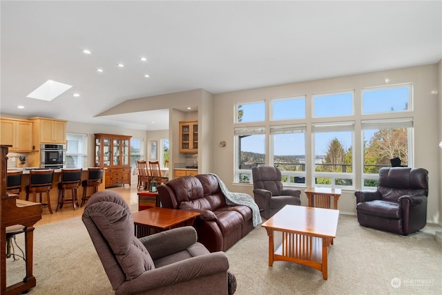 living room featuring a skylight