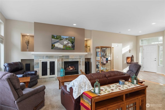 living room with light tile patterned floors and a fireplace