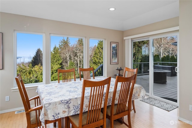 dining room with light wood-type flooring