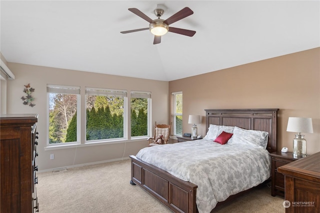 bedroom with lofted ceiling, light carpet, and ceiling fan