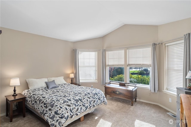 carpeted bedroom with vaulted ceiling