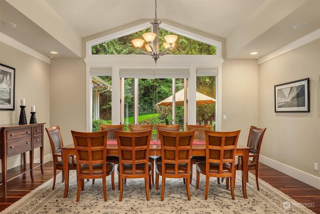 dining space with vaulted ceiling, an inviting chandelier, ornamental molding, and wood-type flooring