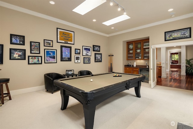 playroom with light colored carpet, indoor bar, crown molding, pool table, and rail lighting