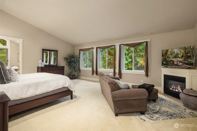 carpeted bedroom with vaulted ceiling