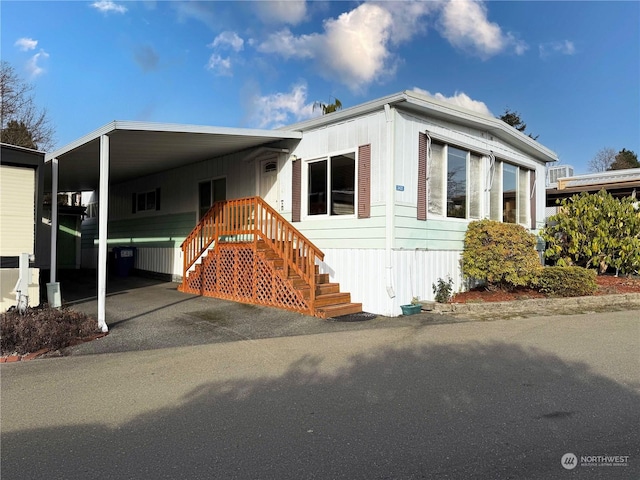 manufactured / mobile home featuring a carport