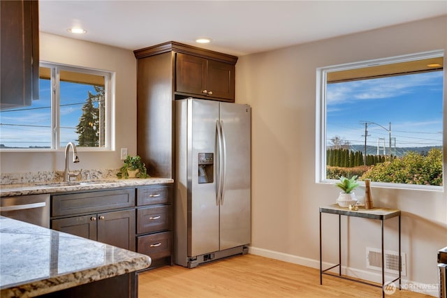 kitchen with plenty of natural light, visible vents, appliances with stainless steel finishes, and a sink