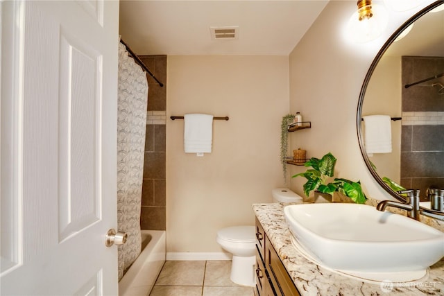 bathroom featuring tile patterned flooring, visible vents, baseboards, toilet, and vanity