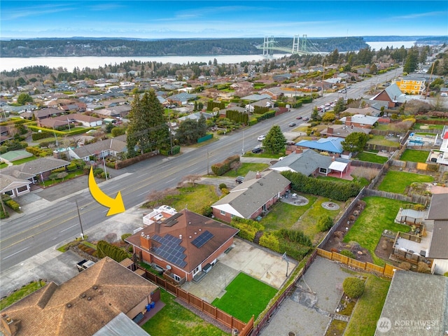 aerial view featuring a residential view and a water view