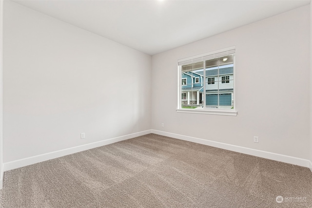 unfurnished room featuring carpet flooring