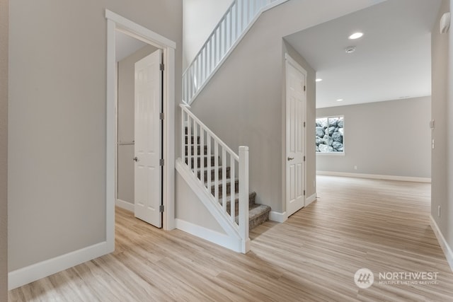 stairway featuring wood-type flooring