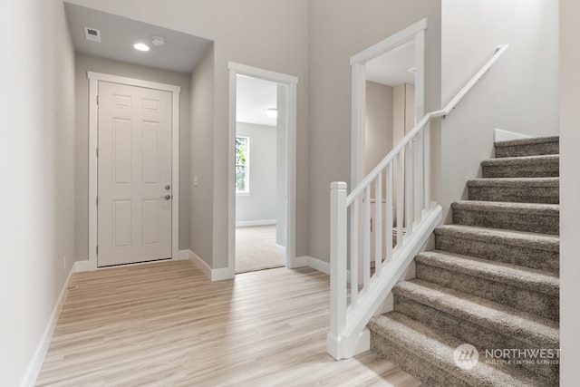 entryway with light hardwood / wood-style flooring