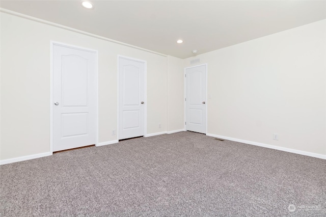 unfurnished bedroom with carpet floors