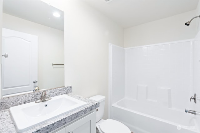 full bathroom with shower / bath combination, vanity, and toilet