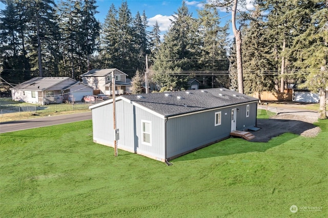 view of outdoor structure with a yard