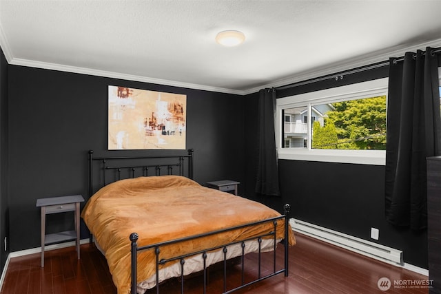750 Crockett St Unit 403, Seattle, WA 98109 - bedroom with a baseboard heating unit, crown molding, and wood finished floors