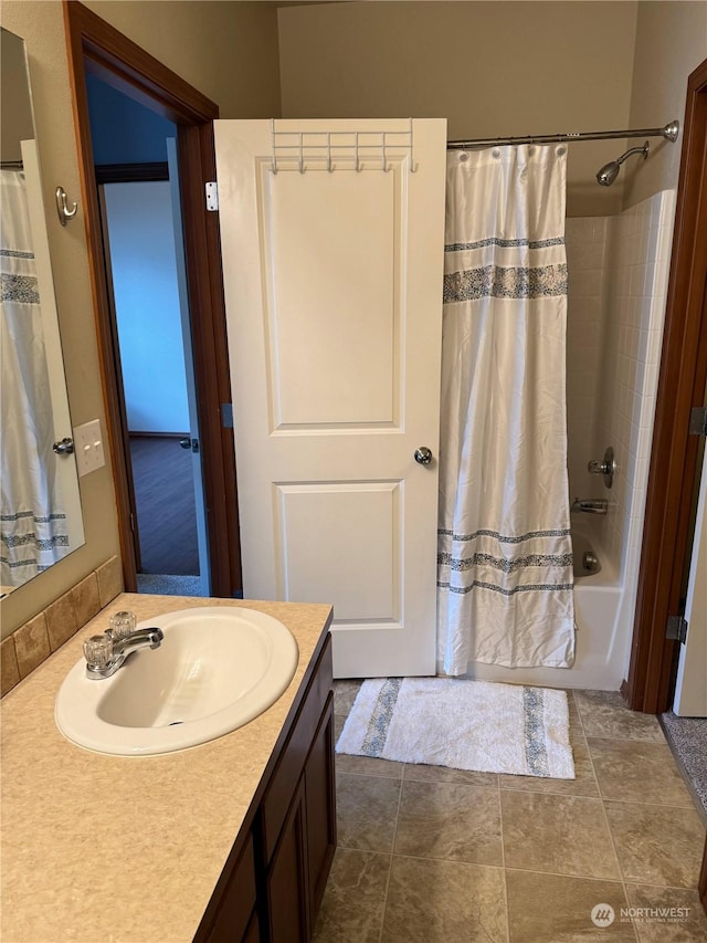 bathroom featuring vanity and shower / bath combo with shower curtain