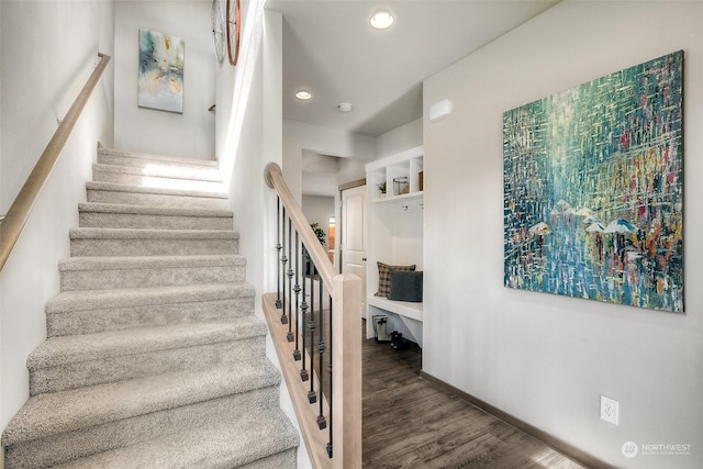 stairway with hardwood / wood-style flooring