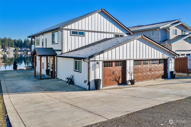 view of front of house featuring a water view and a garage