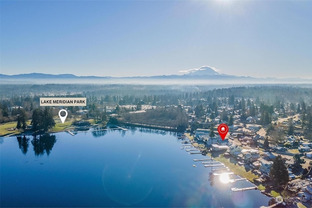 aerial view featuring a water and mountain view