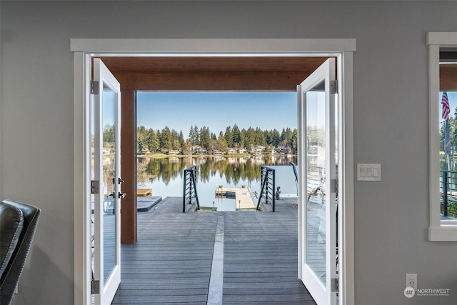 doorway to outside with a water view