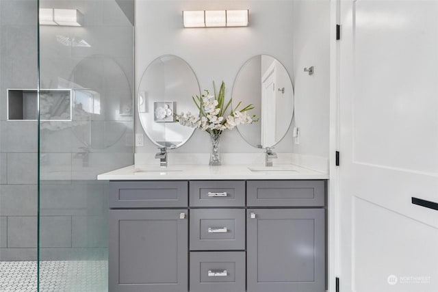 bathroom featuring vanity and a tile shower