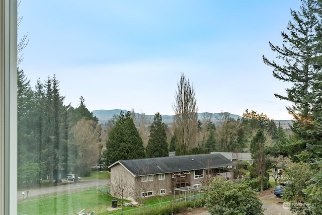 back of house featuring a mountain view