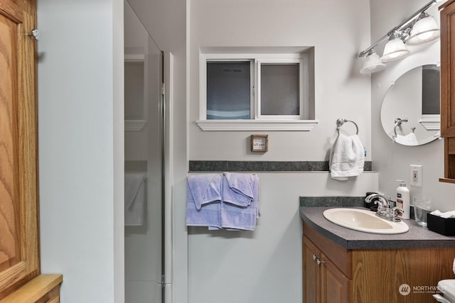 bathroom with vanity and walk in shower