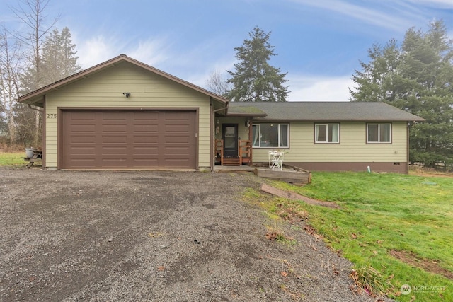 single story home with a garage and a front lawn