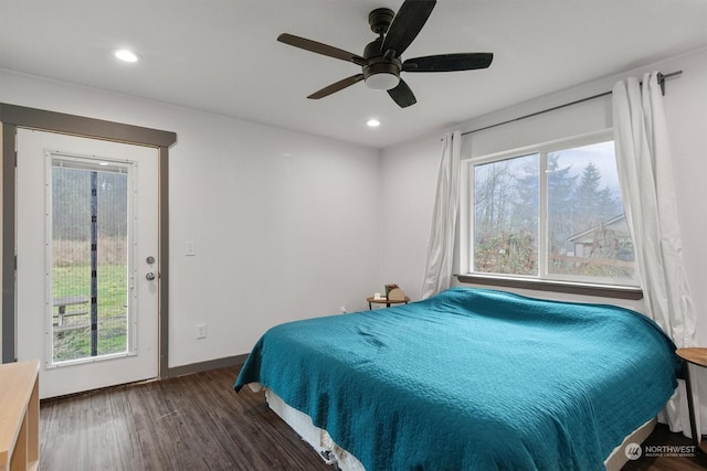 bedroom with ceiling fan and dark hardwood / wood-style flooring