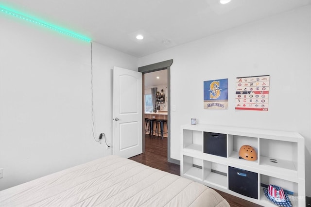 bedroom with hardwood / wood-style flooring