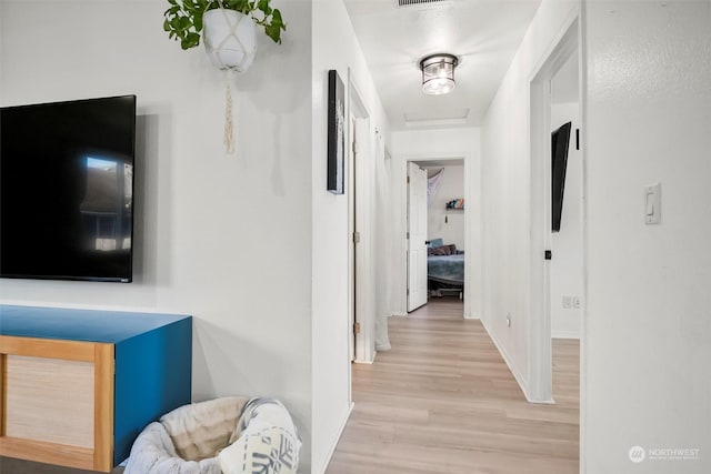 hallway with light wood-type flooring