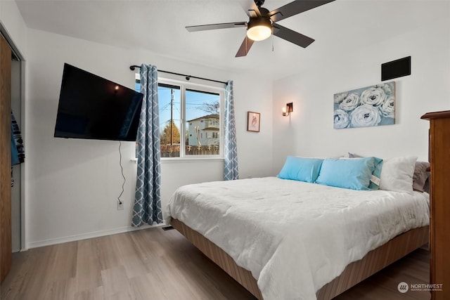 bedroom featuring ceiling fan and wood-type flooring