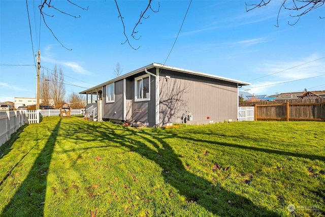 view of home's exterior with a yard